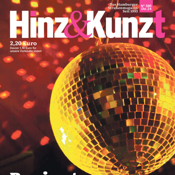 Eine Discokugel reflektiert Lichter an die Decke. Titelzeile: "Panic at the disco"