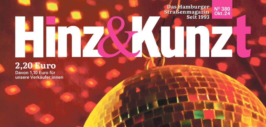 Eine Discokugel reflektiert Lichter an die Decke. Titelzeile: "Panic at the disco"