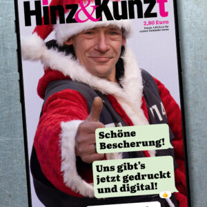 Ein Smartphonebildschirm mit einem Chatverlauf: "Schöne Bescherung! Uns gibt's jetzt gedruckt und digital!" – "Testzugang im Magazin!" Im Hintergrund ein Weihnachtsmann